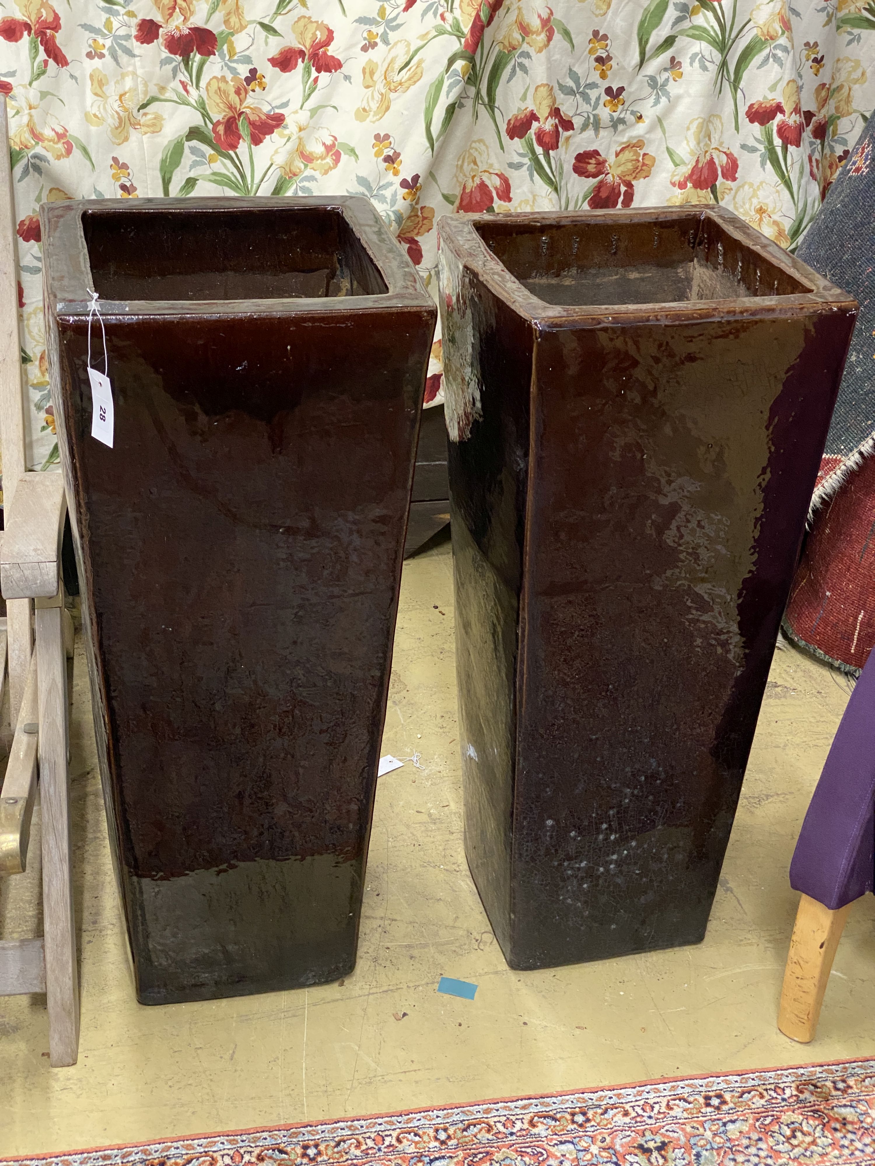 A pair of large brown glazed pottery garden planters, height 90cm